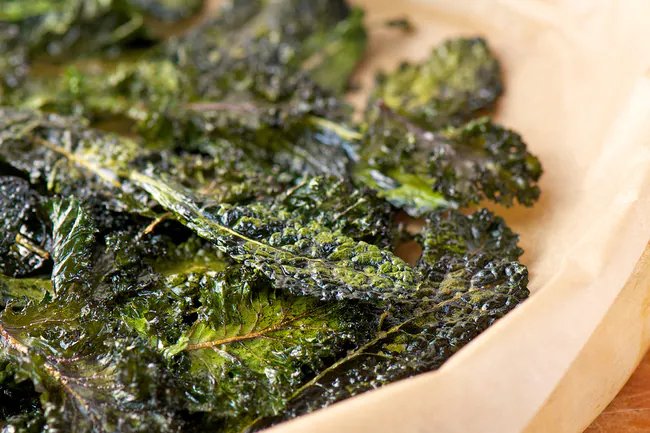 Make your own kale chips by tossing them with olive oil and seasonings and baking them.