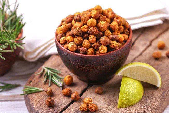 Roasted chickpeas topped with olive oil and spices make a healthy snack.