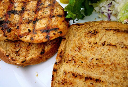 Fresh grilled chicken sandwich on whole wheat bun.
