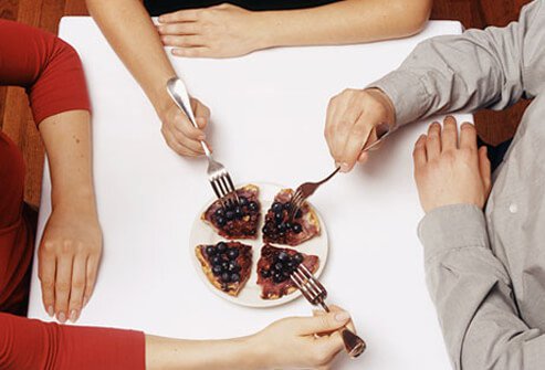 People sharing desert.