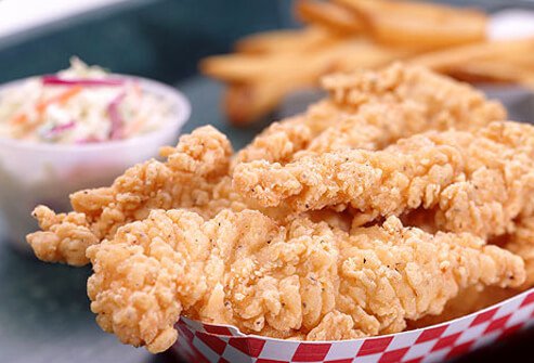 A photo of fried chicken strips.