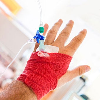 A man getting IV fluids.