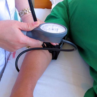 A patient getting blood pressure measured.