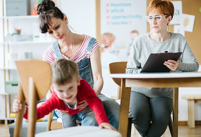 Autism is a developmental disorder that encompasses a variety of symptoms like communication difficulties, behavioral challenges, and social interaction problems. Families cope with autism by managing stress, maintaining energy levels, sticking to a schedule, nurturing other relationships and managing financial stress.