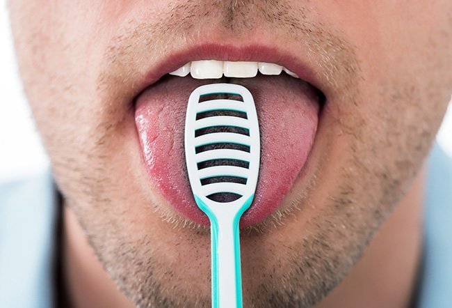 is it bad to scrape your tongue
