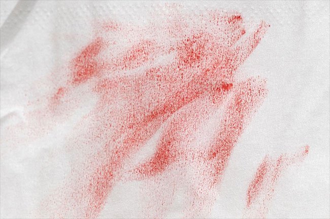 Try a stain stick or heavy-duty liquid detergent to remove lip balm or lipstick stains from clothes.