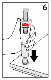 Remove the paper tab from the
end of the outer cap - Illustration