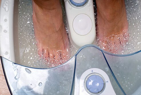 Do try to coax a stuck toenail out from beneath overgrown skin by soaking the affected foot three to four times a day.