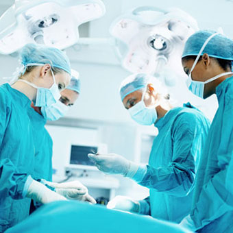 A medical team performs surgery.