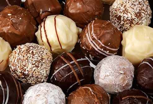 Assorted chocolates on a glass platter.