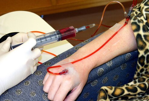 A patient receives a chemotherapy injection.