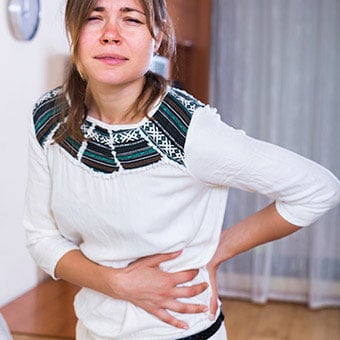 A woman suffers a pancreatic attack.