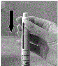 Keep the pre-filled pen upright in the dosing tray and press the top half of the pre-filled pen downward - Illustration