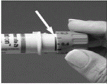 Turn the dosing button until your prescribed dose is lined up with the
dosing tab - Illustration