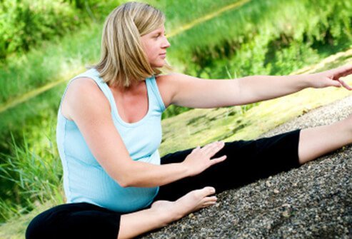 Stretch to help warm up before your workout.