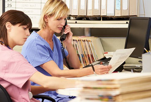 Two nurses working in a doctor's office.