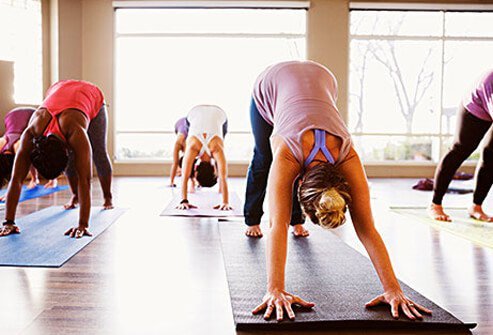 Women active in a yoga class.