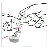 Place the tip of the syringe into the powder and infant formula mixture in the medicine cup - Illustration