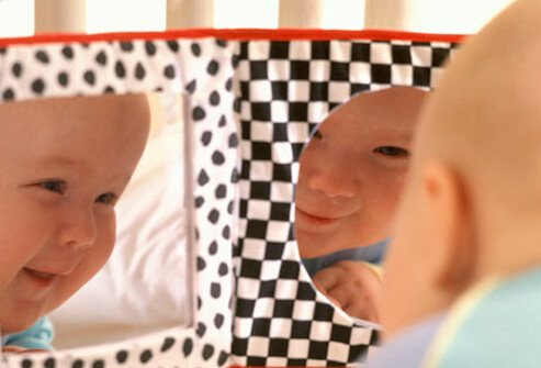 By 3 months of age, infants can bring their hands to the midline (in front of their face).
