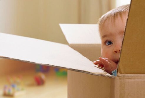Many 9-month-old children find exploration of their parent's faces great fun.