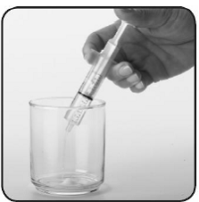 Slowly push the oral syringe plunger all the
way down to empty the water from the oral syringe straight into the cup
containing the SABRIL  - Illustration