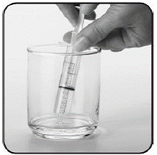 Put the tip of the oral syringe all the
way into the mixture - Illustration