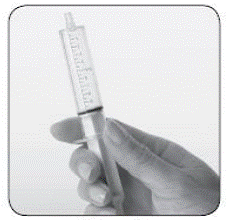 If you see bubbles of air in the oral syringe after
drawing up the water, turn the oral syringe so the tip is pointing up - Illustration