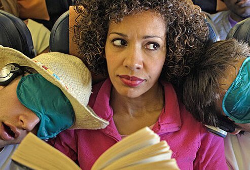 Photo of woman squashed on plane.