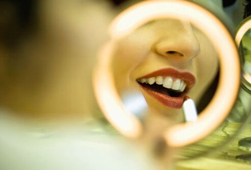 Photo of lipstick lit in mirror.