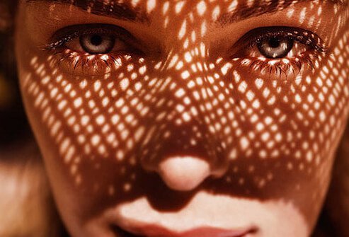 Photo of woman wearing sun hat.