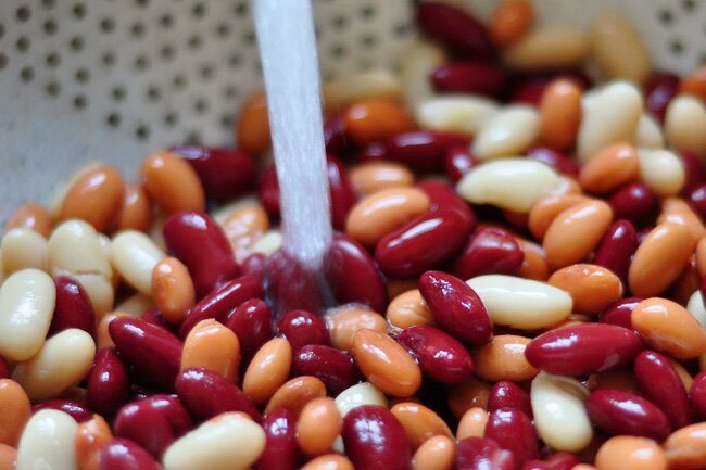 Rinsing canned beans removes approximately half of the sodium in them.