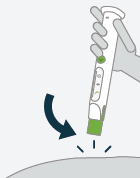  If the green top is removed
from the skin before completing the injection, the auto-injector will pause the
injection  - Illustration