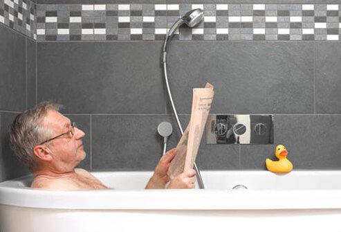 Photo of an older man taking bath.
