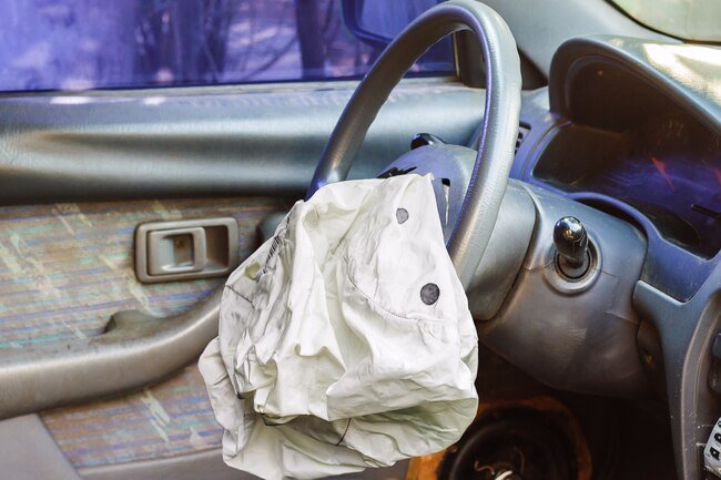 Sodium azide used to trigger air bag deployment may trigger asthma and breathing problems.