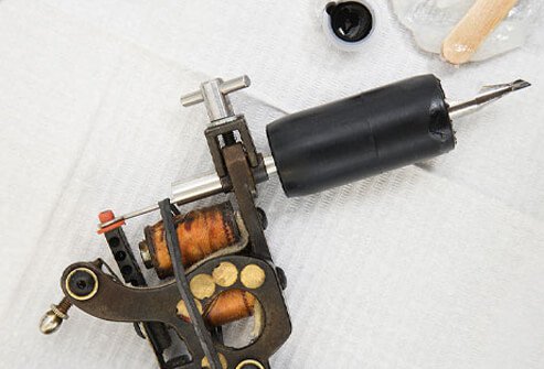 Close Up of tattoo gun and ink.