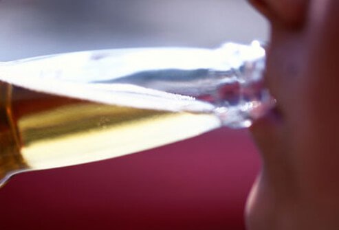A teen drinks beer.