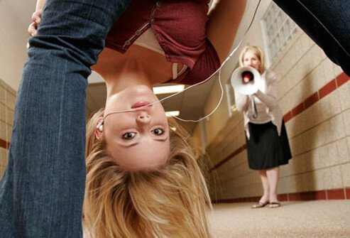 A girl caught in trouble by the school principal.