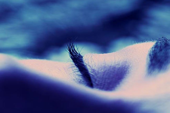 Prop yourself up while you sleep to reduce puffy eyes.