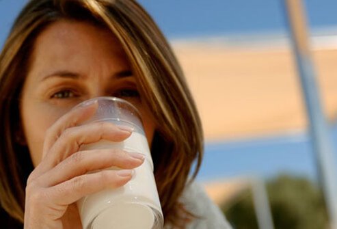 Photo of a woman drinking milk.