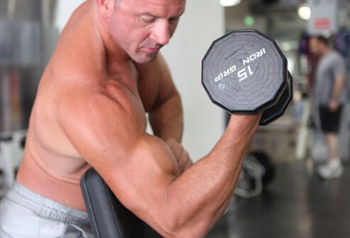 This twist on the curl better isolates the biceps.