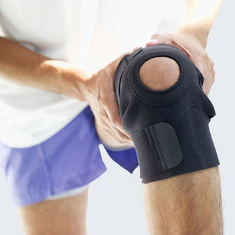 A man wears a knee brace.