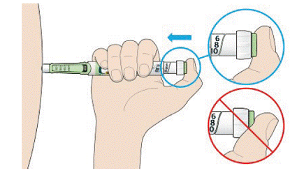 Place your thumb on the injection button - Illustration