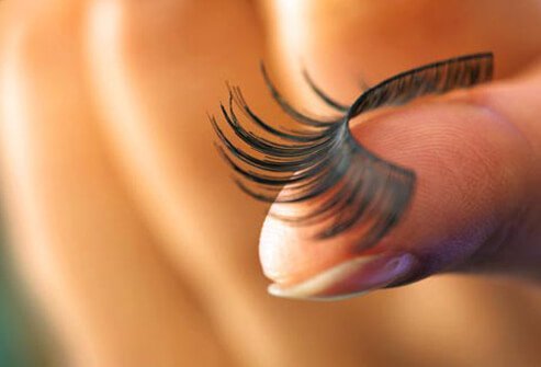 Photo of fake eyelash on finger.