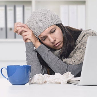A woman with an upper respiratory infection and used tissues which are contagious and cause transmission of the infection.