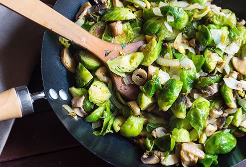Brussels sprouts with onions, garlic, and olive oil are a tasty source of protein.