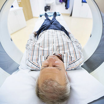 A man gets an MRI of his head to look for possible causes of vertigo.