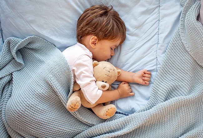 when should child sleep in their own bed