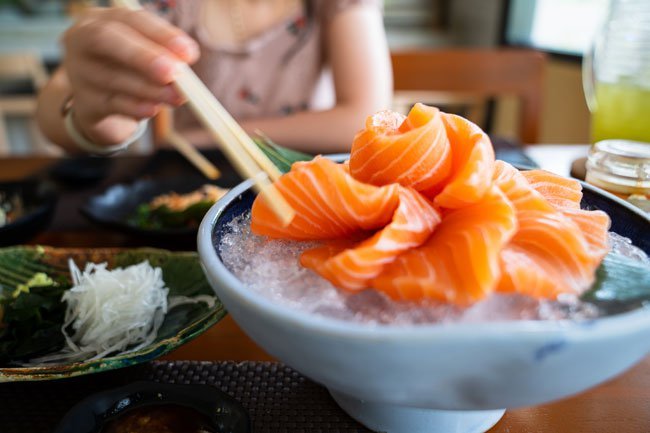 Foods such as unpasteurized dairy, processed meat, raw or undercooked seafood, raw eggs, raw meat, unwashed fruits and vegetables are considered dangerous to eat anytime during pregnancy.