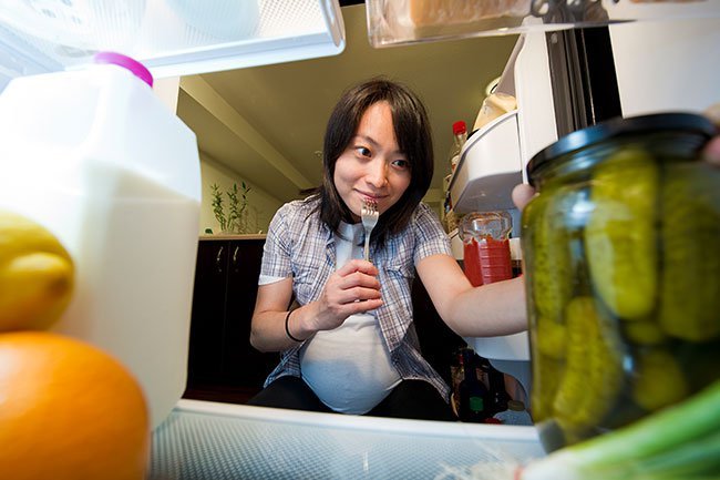Often, women will crave salty or sour foods like pickles or salty foods like potatoes, french fries, or salted fish.