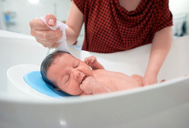 Giving your newborn baby a bath can feel a bit intimidating, but if you follow some easy steps to bathing a newborn, those first baths can be not only safe but also calming, memorable, and even fun.